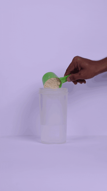 Preparing a Protein Shake With a Scoop of Clean Plant Protein