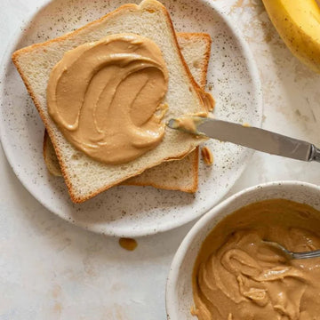 Delicious and Creamy Peanut Butter Spread on Fresh Bread