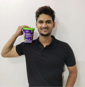 Rahul Sharma holding Alpino peanut butter