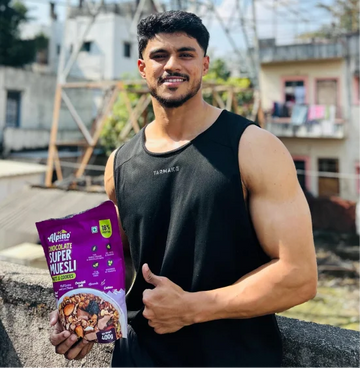 Rohan Malhotra holding Alpino super museli