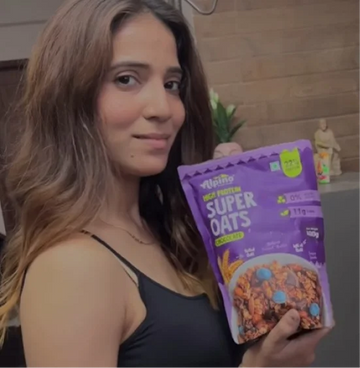 Sneha Gupta holding Alpino Super Oats Chocolate Flavour
